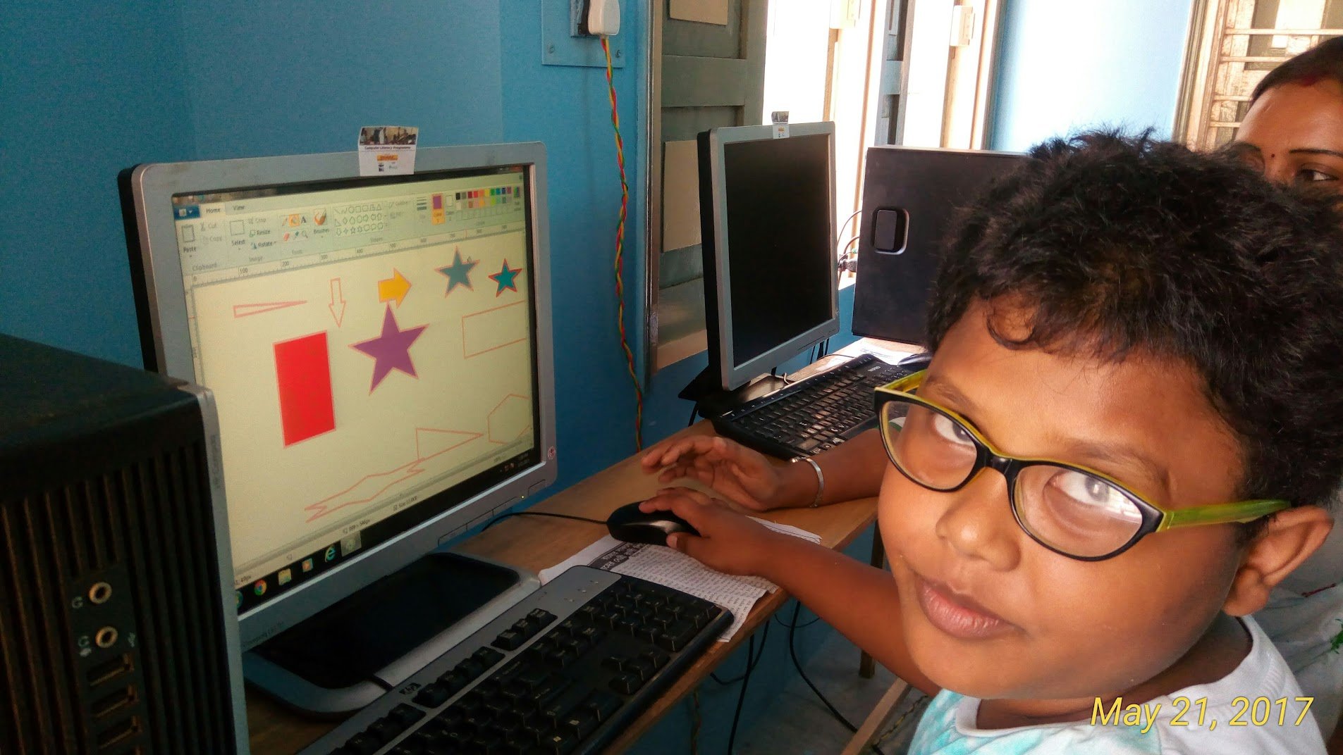Girls studying with teacher in special education class at KLI
